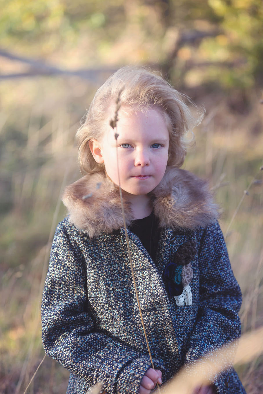 Autumnal outdoor portrait of a little girl